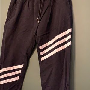 Black joggers with white stripes